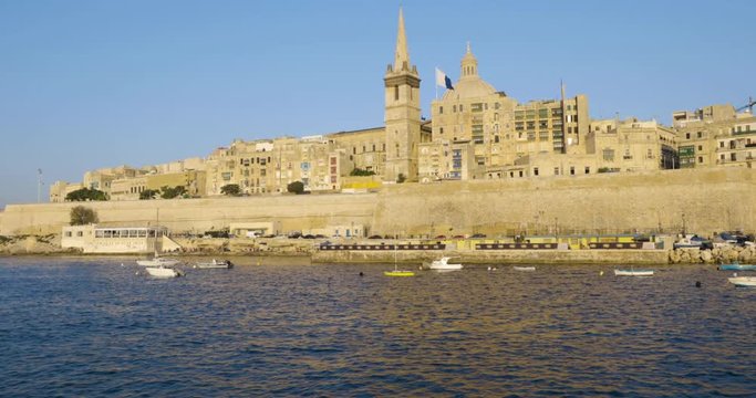 Historic city of Valetta, Malta, harbour sunset view from a boat