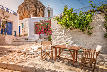 Traditional Greek street in town centre at sunset time, Amorgos Island, Greece.