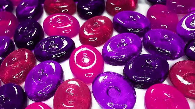 Hard candy candies closeup texture rotating video background