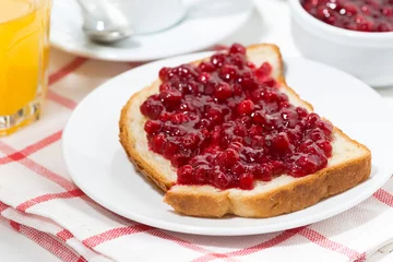 Foto op Plexiglas toast with cranberry jam for breakfast, closeup © cook_inspire