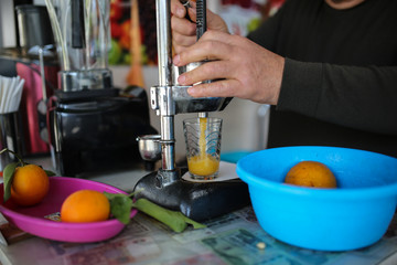 metal manual juicer, preparing fresh juice