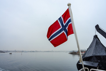 Fototapeta premium flag of norway in the back of boat 