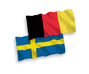 National vector fabric wave flags of Sweden and Belgium isolated on white background. 1 to 2 proportion.