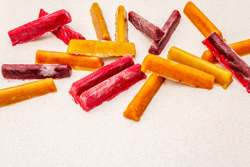 Frozen assortment of fruit purees in the form of sticks