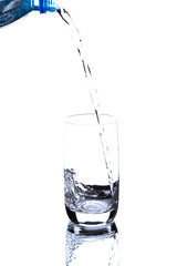 pouring water on a glass on white background