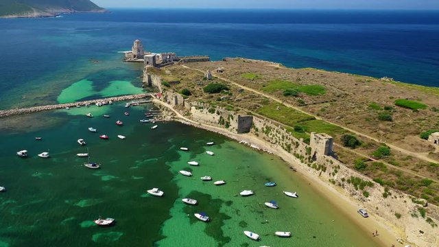Aerial drone video of iconic and unique medieval castle and Bourtzi tower of Methoni in the heart of Messene, Peloponnese, Greece