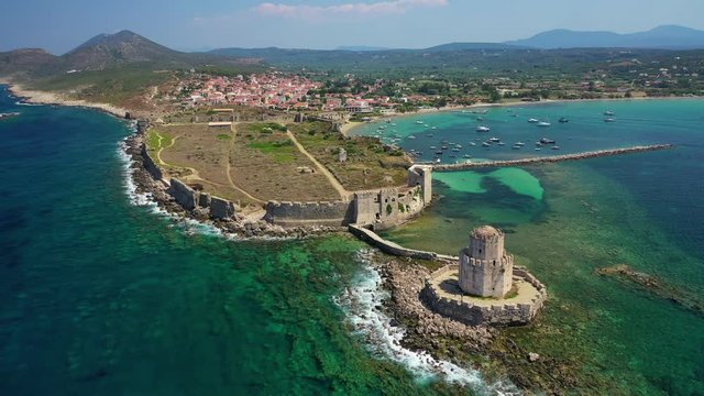 Aerial drone video of iconic and unique medieval castle and Bourtzi tower of Methoni in the heart of Messene, Peloponnese, Greece