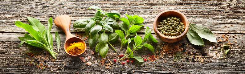 Herbs in closeup on wooden background