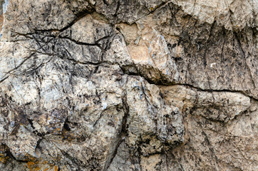 Old stone wall made of hard stone