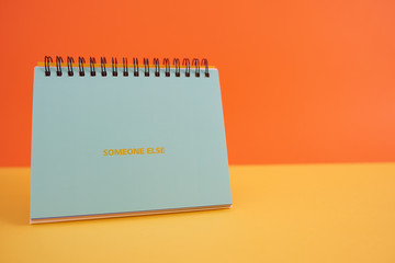  Colorful background with a notebook on top of a table and a notebook. Contemporary and youth design.