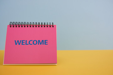  Colorful background with a notebook on top of a table and a notebook. Contemporary and youth design.