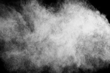 White powder explosion on black background. Colored cloud. Colorful dust explode. Paint Holi.
