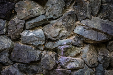 Part of the stone wall, for background and texture. Rough cut natural stone