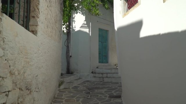 Slow-motion walking through typical Greek Village comma first-person view.