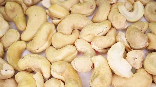 Cashew cashews nuts closeup texture rotating video background