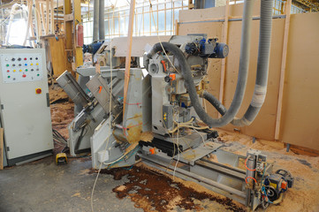 Wood processing machines and pieces of products in a furniture factory