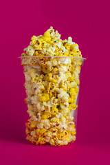 popcorn bucket to watch cinema film, on color background
