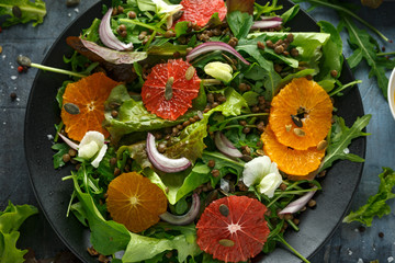 Orange and grapefruit Citrus salad with lentills vertes, wild rocket, arugula, red onion and...