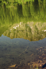 Scenic Alps lake with reflection in water