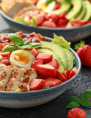Chicken Cobb salad with strawberries, bacon, avocado and boiled eggs