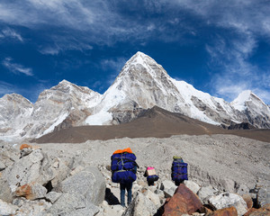 Nepalese porters carrying a heavy load to the pass on the road to Everest Base camp in Sagarmatha...