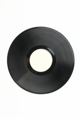 Vinyl record with white label. Black vinyl plate over white background, vertical image.