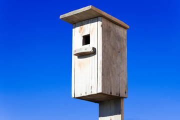 birdhouse on blue sky