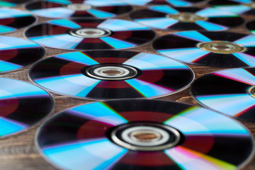 Blue compact discs wallpaper. Background of many colorful compact discs. Digital data storage...