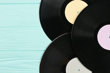 Set of vinyl records close up. Three vinyl plates with different labels and copy space. Retro music albums.
