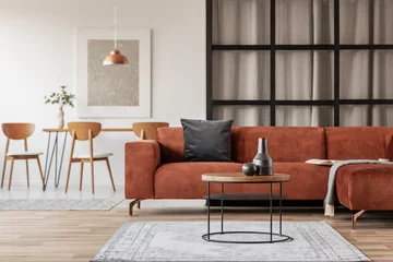 Fotobehang Boho Silver abstract painting in white frame on the wall of trendy living room interior with brown corner sofa  © Photographee.eu