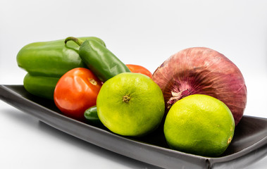 Colourful ingredients for pico de gallo on boards and in bowls. Calgary, alberta, Canada