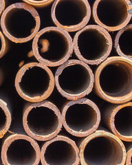 Rusty metal pipes from the butt, texture background
