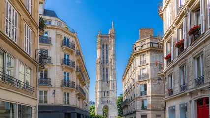 Paris, beautiful building rue Nicolas-Flamel, typical parisian facades and windows, with the...