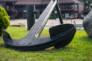 old ship anchors on the grass