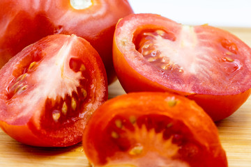 Red tomatoes on a wooden cutting board. Calgary, Alberta, Canada