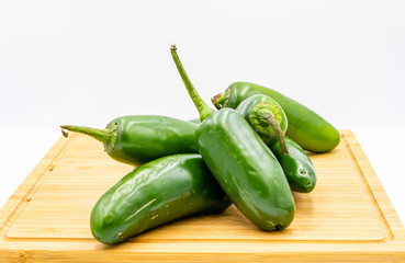 Jalapeno peppers on a wooden cutting board. Calgary, Alberta, Canada