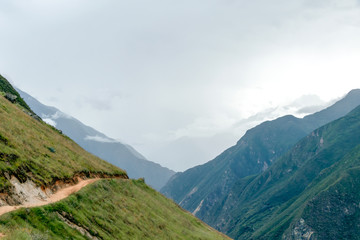 Naklejka premium Hiking path at high altitude Peruvian mountains, the Choquequirao trek to Machu Picchu, alternative to Inca Trail, Peru