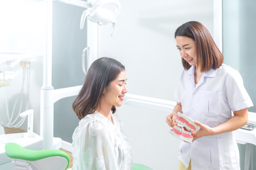 Fototapeta premium Portrait of a dentist being positive about oral health of patient
