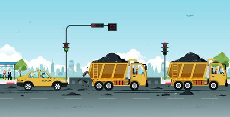 Obraz premium Dump truck drivers make dirt roads with soil.