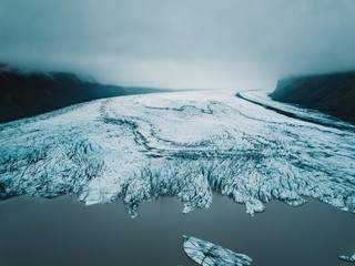 Aerial view of glacier in Iceland. The tongue of Vatnajokull glacier. Beautiful ice pattern. 