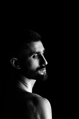 Black and white portrait. Man with long beard. Hipster profile portrait. Serious man silhouette. Open eyes. Looking forward.