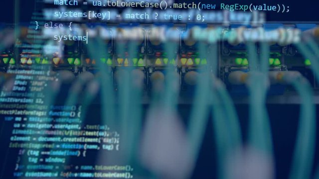 Working computer with a code on a screen.