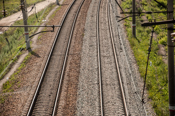 Fototapeta premium railway top view with stone and green plant beside railway, abstract background