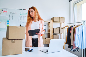 bussinesswoman checking deliveries running e-business