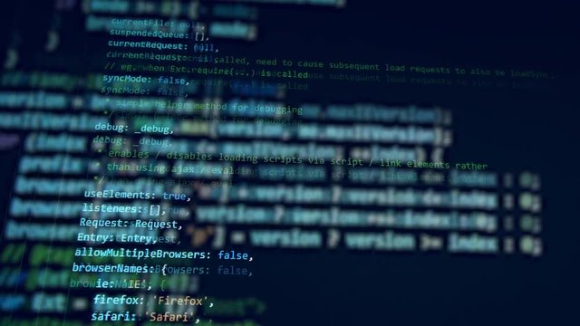 A working computer with a code on a monitor.