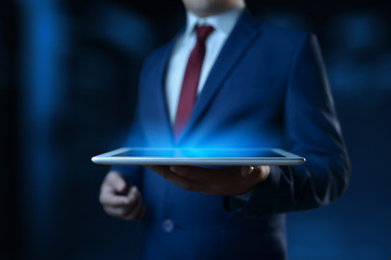 Businessman holding digital tablet. Man using gadget in office