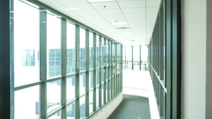 Obraz premium rows of glass windows on the office building