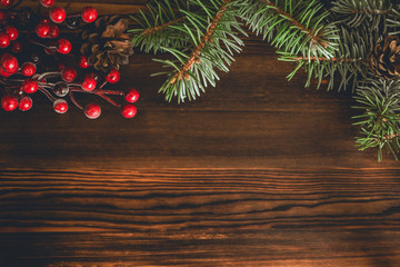 Wooden board with holly and pine branch. Merry Christmas and New Year concept. Christmas...
