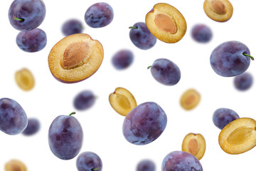 Falling plum isolated on white background, selective focus