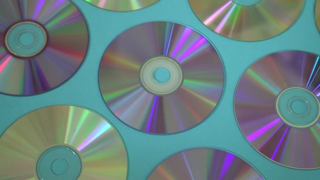 Vintage CD or DVD disk background, old circle discs used for data storage, share movies and music